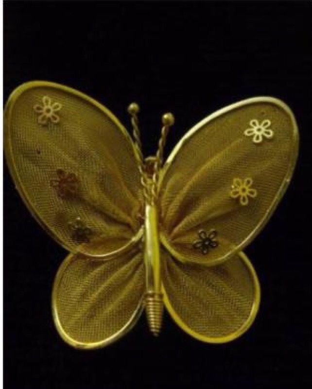 Gold tone mesh butterfly pin