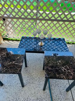 A set of three marble coffee tables.    Like new.