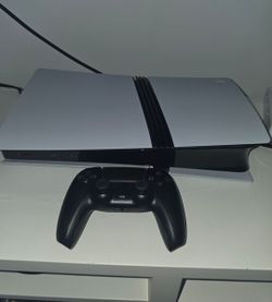 PS5 Pro with black controller and all cables