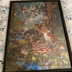 3 Pictures in frames, the brown one is homemade.