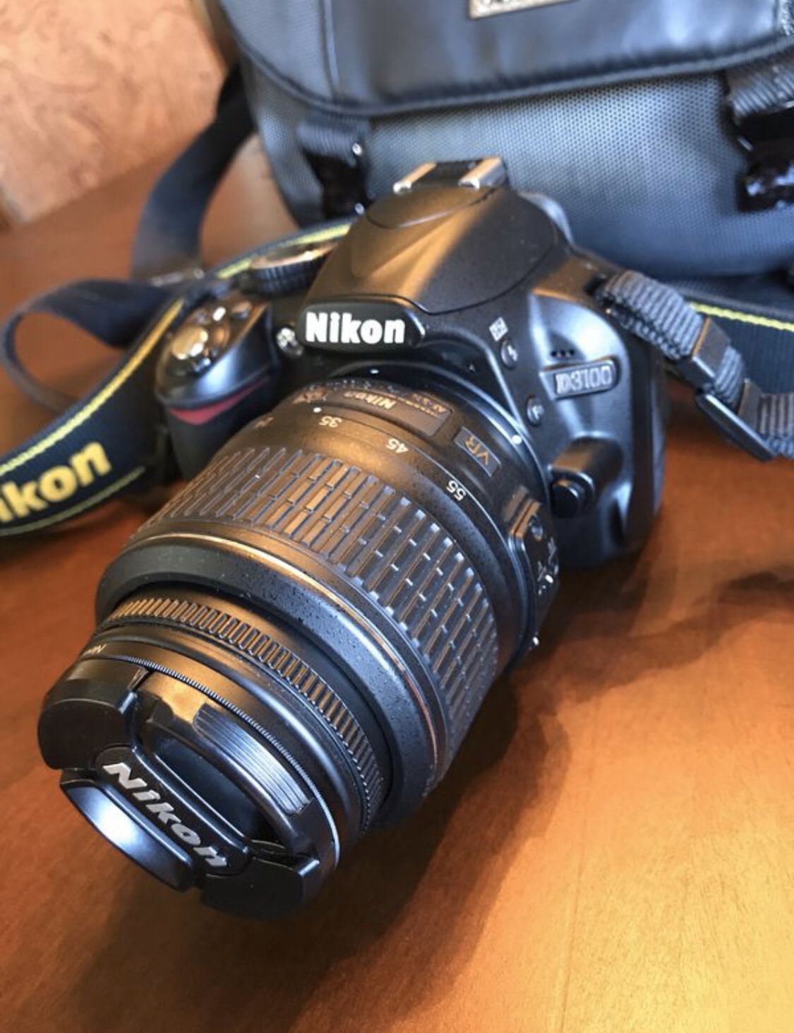 Nikon D3100 DSLR with 18-55mm Autofocus Aspherical Nikon Lens and extras