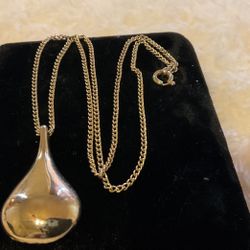 Goldtone Necklace With A Pear Shaped Solid Pendant 