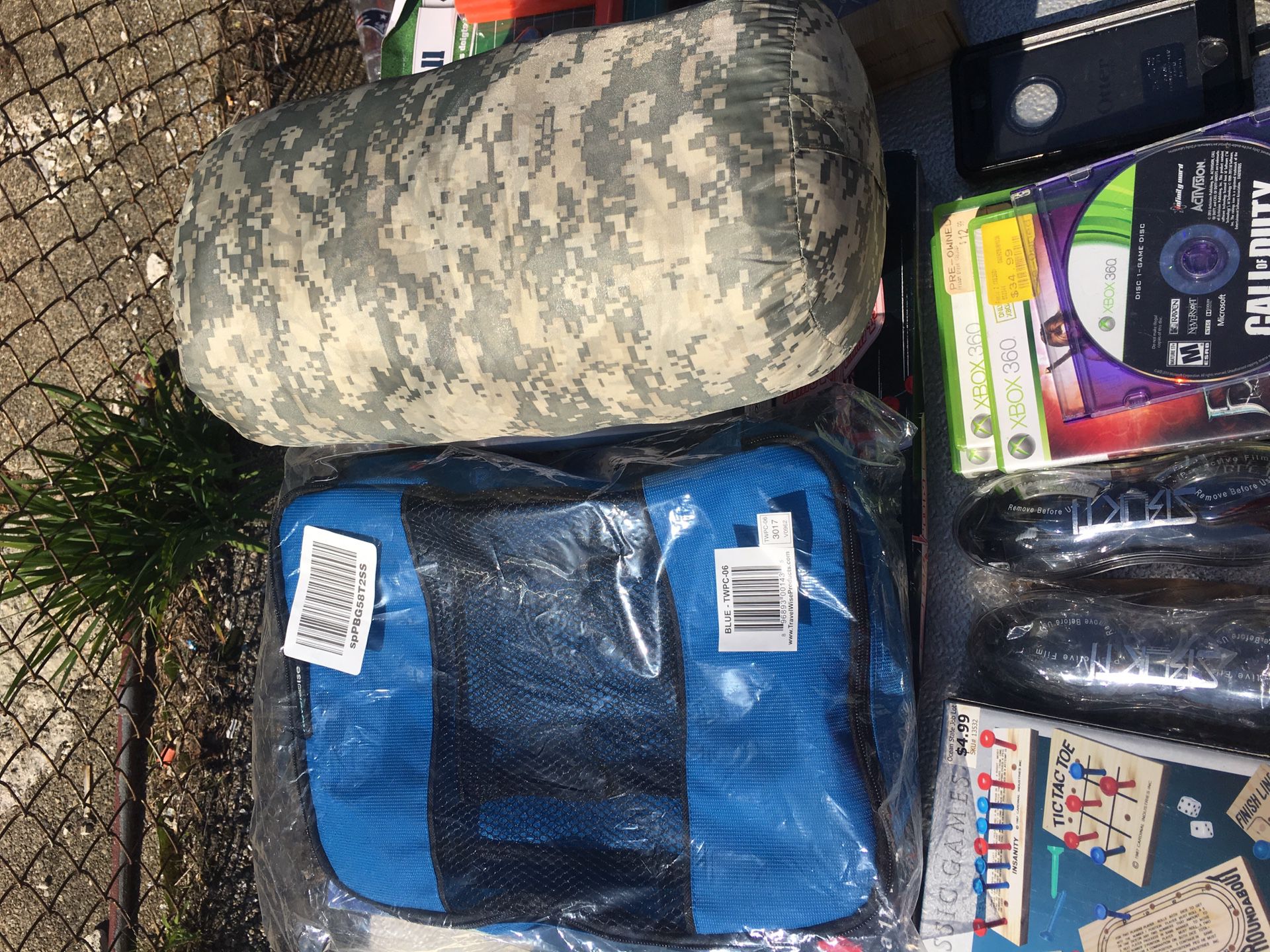 Selling a sleeping bag with luggage bags
