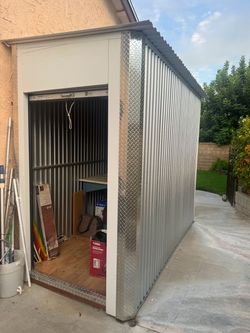 Metal Outdoor Storage Shed with Roll-Up Door