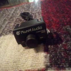The device shown is a remote subwoofer level control for a Planet Audio car amplifier, likely part of their Anarchy series. It allows users to adjust&