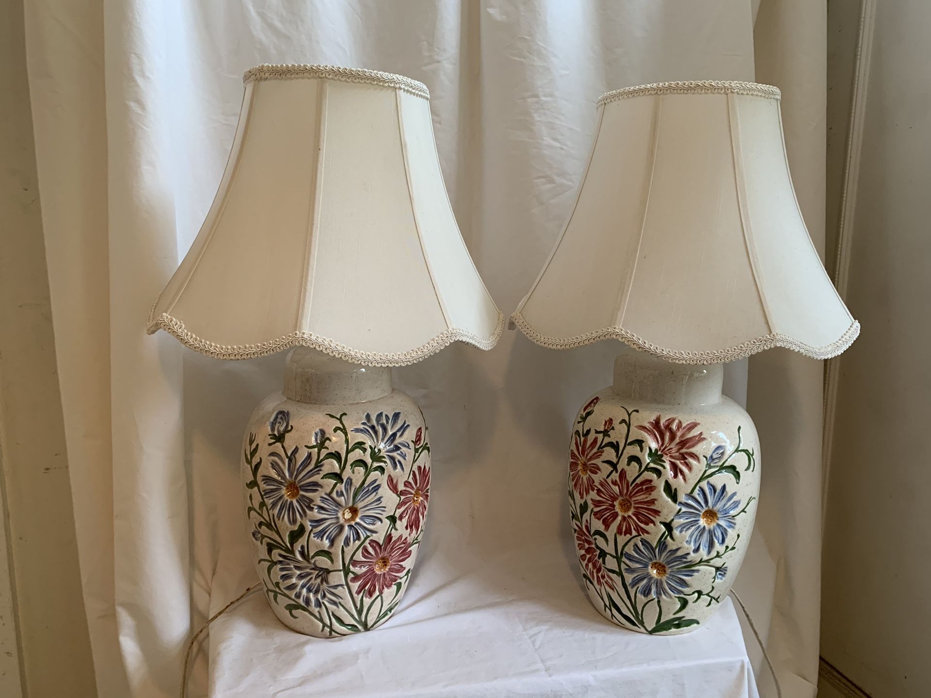 Pair of flower based lamps with shades