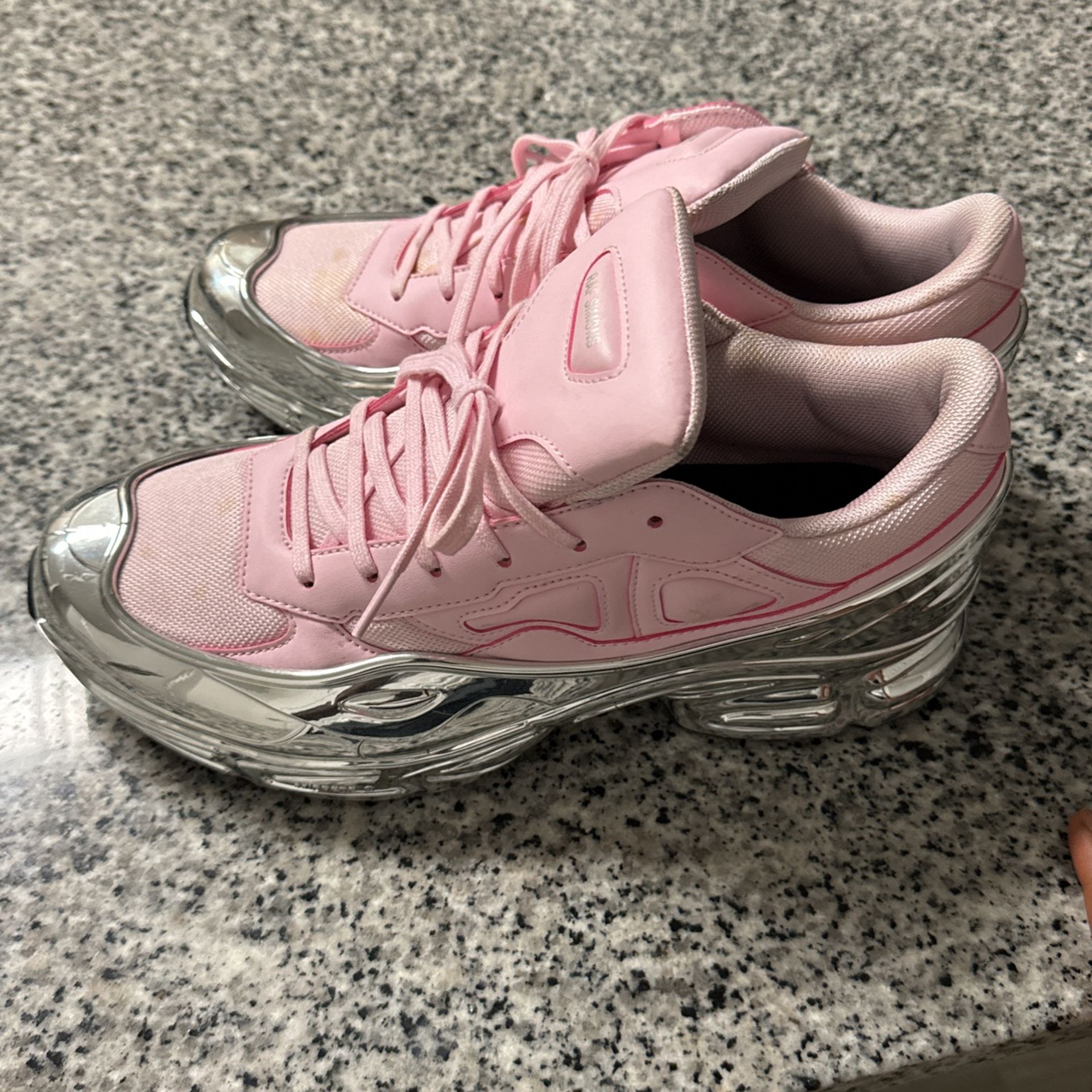 RAF Simmons X Ozweego Mirrored Clear Pink.