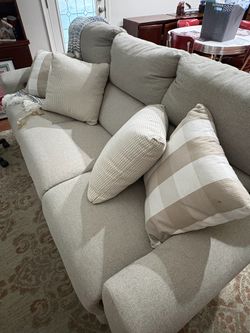 Cream dual-reclining sofa