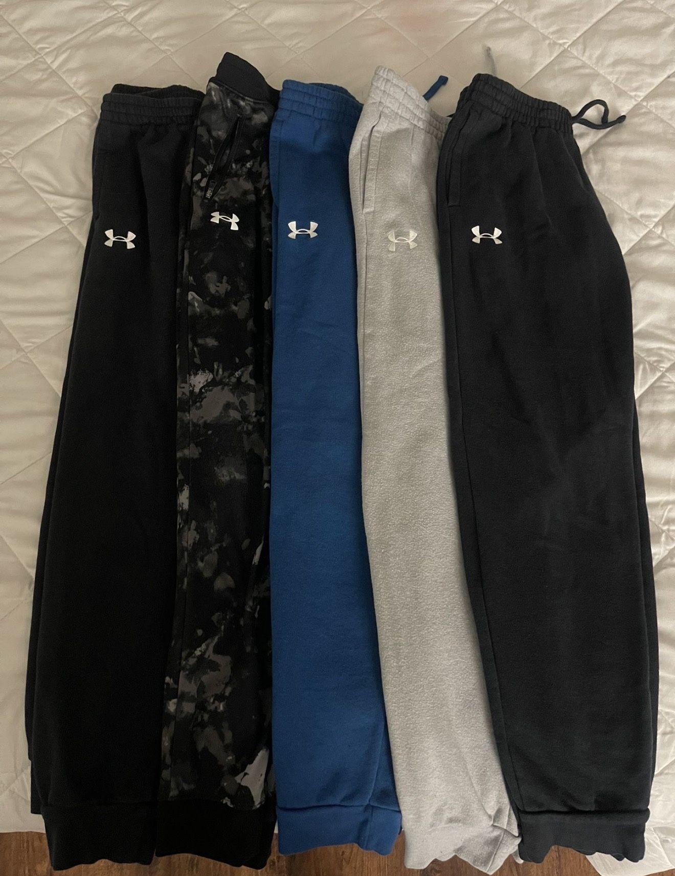 Bundle of 5 Under Armour joggers (Youth Large). All in good to great used condition with normal wear.