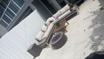 L -shape patio set with active fire pit