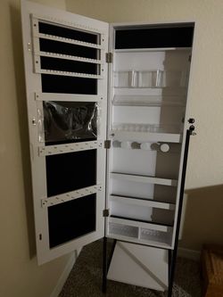 Jewelry cabinet with mirror