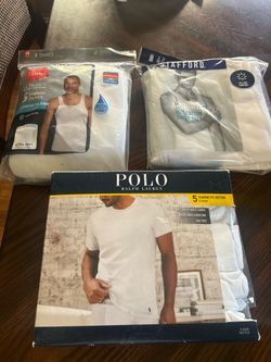 2 packages of white muscle shirts and a pack of polo T shirts size medium