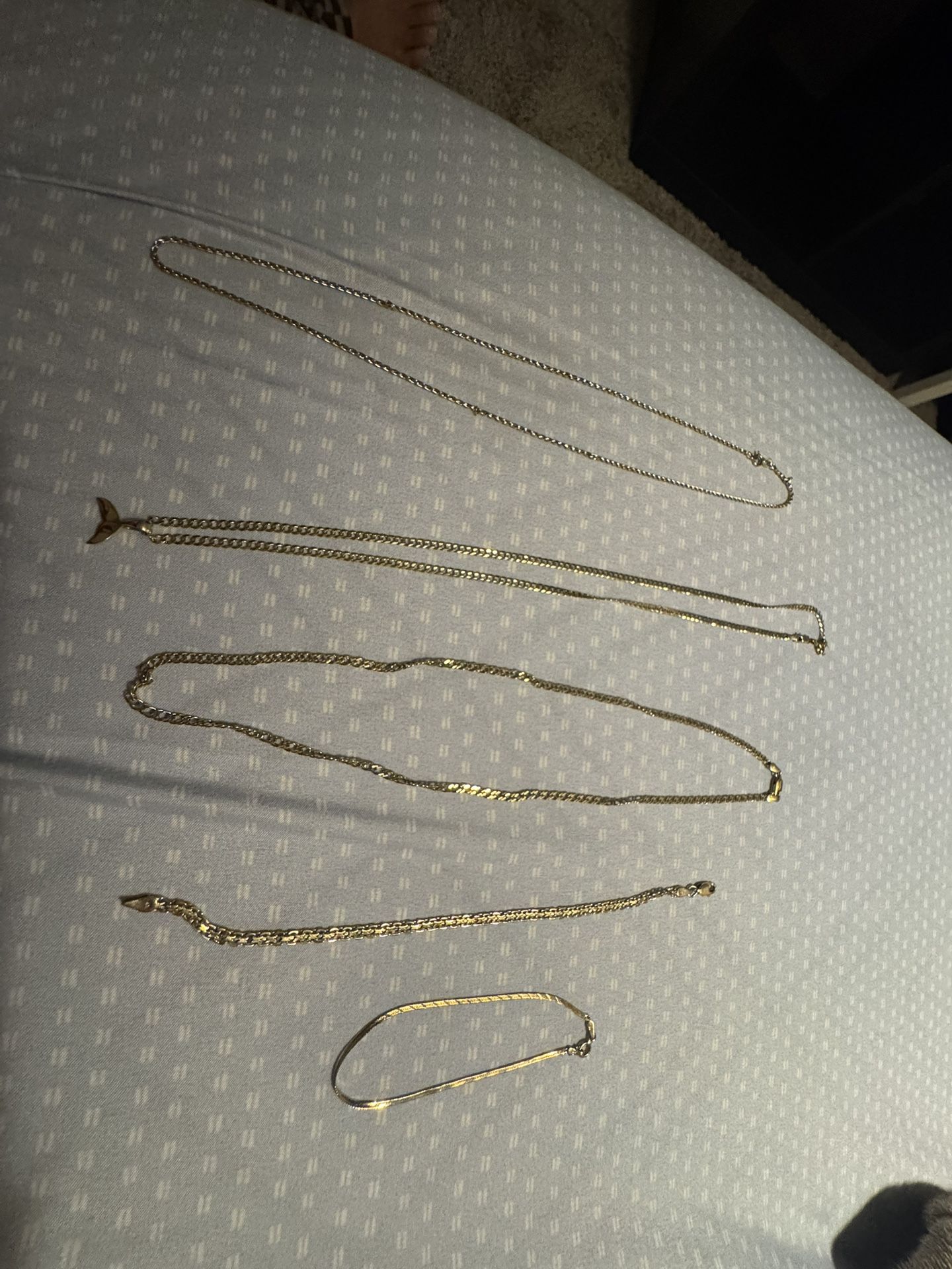 Gold chain and bracelets.