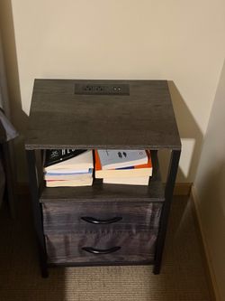 Bed side table with built in outlet