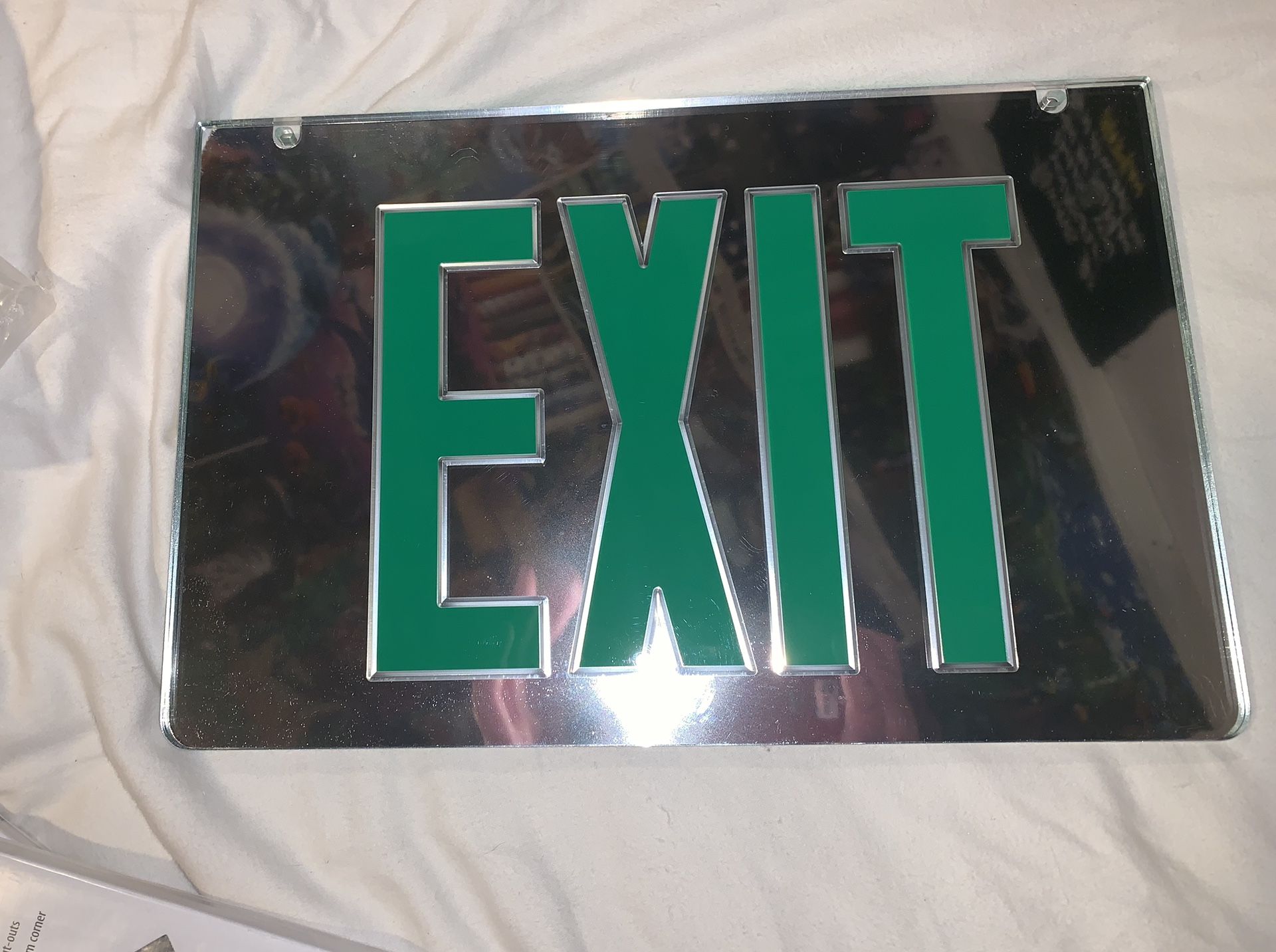 Mirrored exit signs
