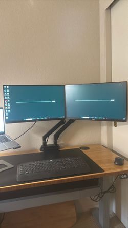 Dual monitors with dual monitor arm setup