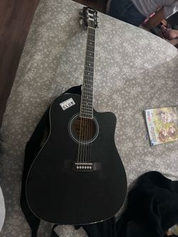 Monkey guitar works good has new strings