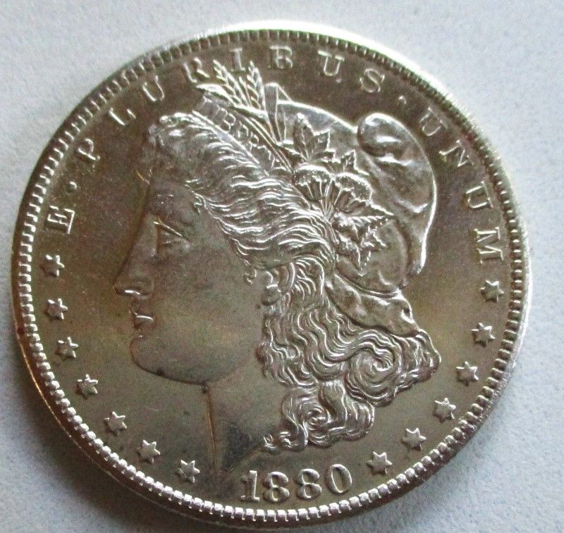 1880-CC MORGAN SILVER DOLLAR. UNCERTIFIED, UNCIRCULATED. BETTER GRADE.