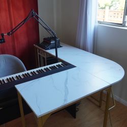 White l-shaped desk with gold legs