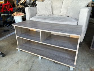 Gray wooden TV stand or bookshelf
