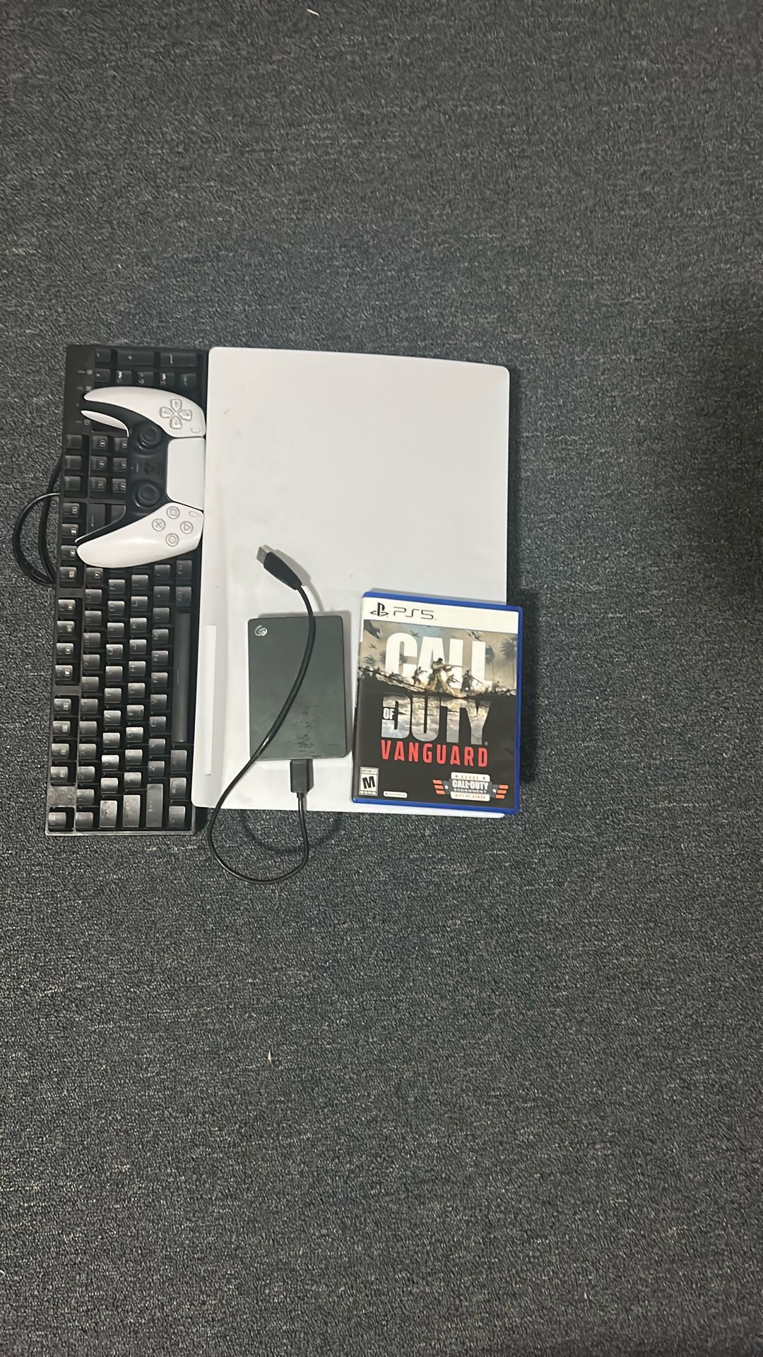 Ps5 disc version, Redragon K552 Mechanical Gaming Keyboard, 1 terabyte of storage, and controller.
