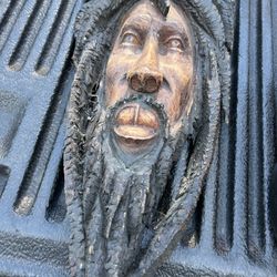 Wooden face sculpture