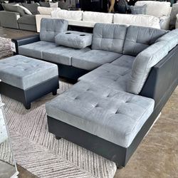 Grey Microfiber Reversible Sectional With Cup Holder And Storage Ottoman. Brand New. 