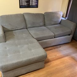 Large sectional couch with storage. Turns into bed.