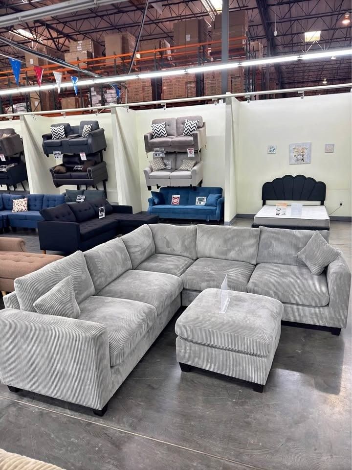 Gray corduroy sectional sofa with ottoman
