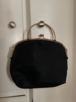 Women’s kiss lock bag