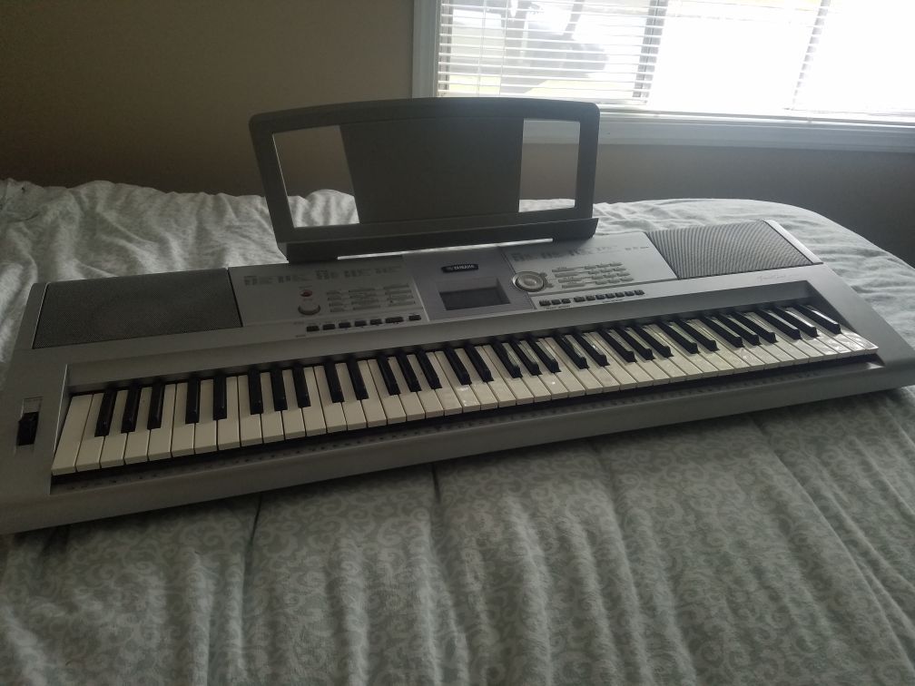 YAMAHA portable grand DGX-205 keyboard.