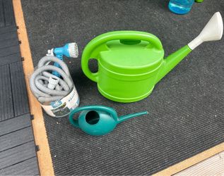 Garden watering cans and hose