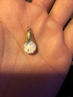 Unique oil filled glass globe pendent filled with opal chips