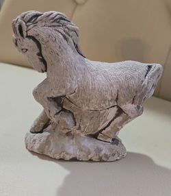 Concrete horse figurine