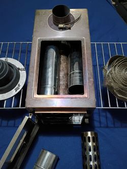 Wood burning stove has all the attachments fiberglass tape everything spark arrester.
