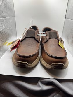 A pair  of brown leather shoes Roper men’s