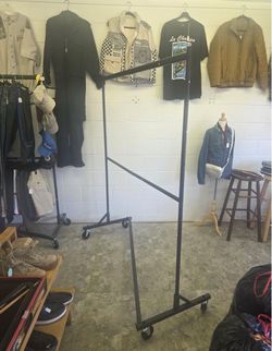 2-tier clothing rack, rolls around smoothly