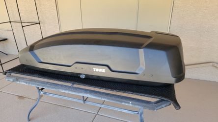 Thule Force XT L rooftop cargo box with mounting hardware, locks and keys.