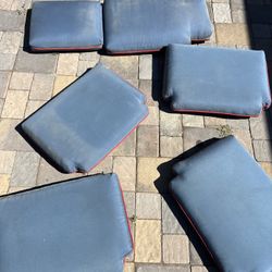 5 piece outdoor patio cushions in blue with red stitching   Located in concord  Covers are not washable  No damages or tears   Measures 26”x 26” The f