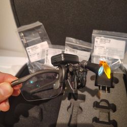 Spark Cordless Headlight and Two Dental Loupes with charger, case, and accessories