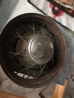 2 = 1930’s Ford OEM 18” steel wire spoke rims , 5 lug , V-8 center cap
