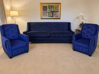 Blue three piece living room couch and chair set
