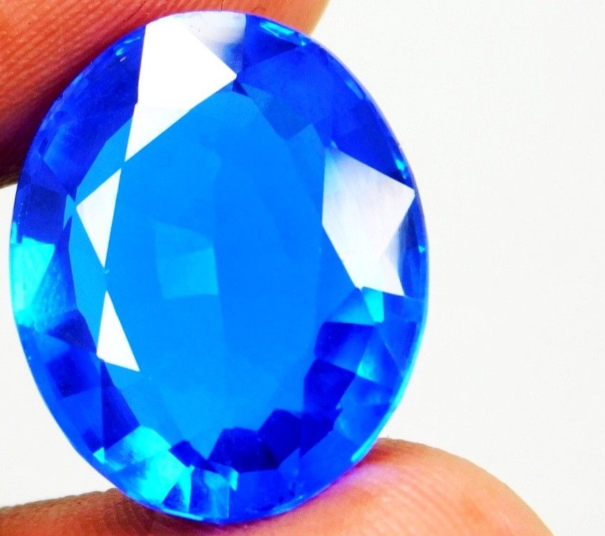 12.00 Ct (Est.) Natural Tanzanite-Like Zoisite Blue Excellent Oval Cut Gemstone. All measurements are approximate. This product is a 12.00 Ct natural