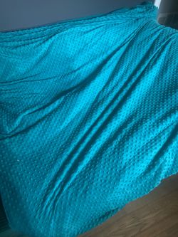 Weighted teal throw