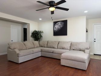 Tan large sectional- free delivery