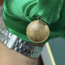 Azteca double sided gold pendant