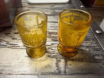 Vintage pair New Orleans amber shot glasses