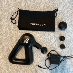 Theragun With Charger And 4 Different Tips