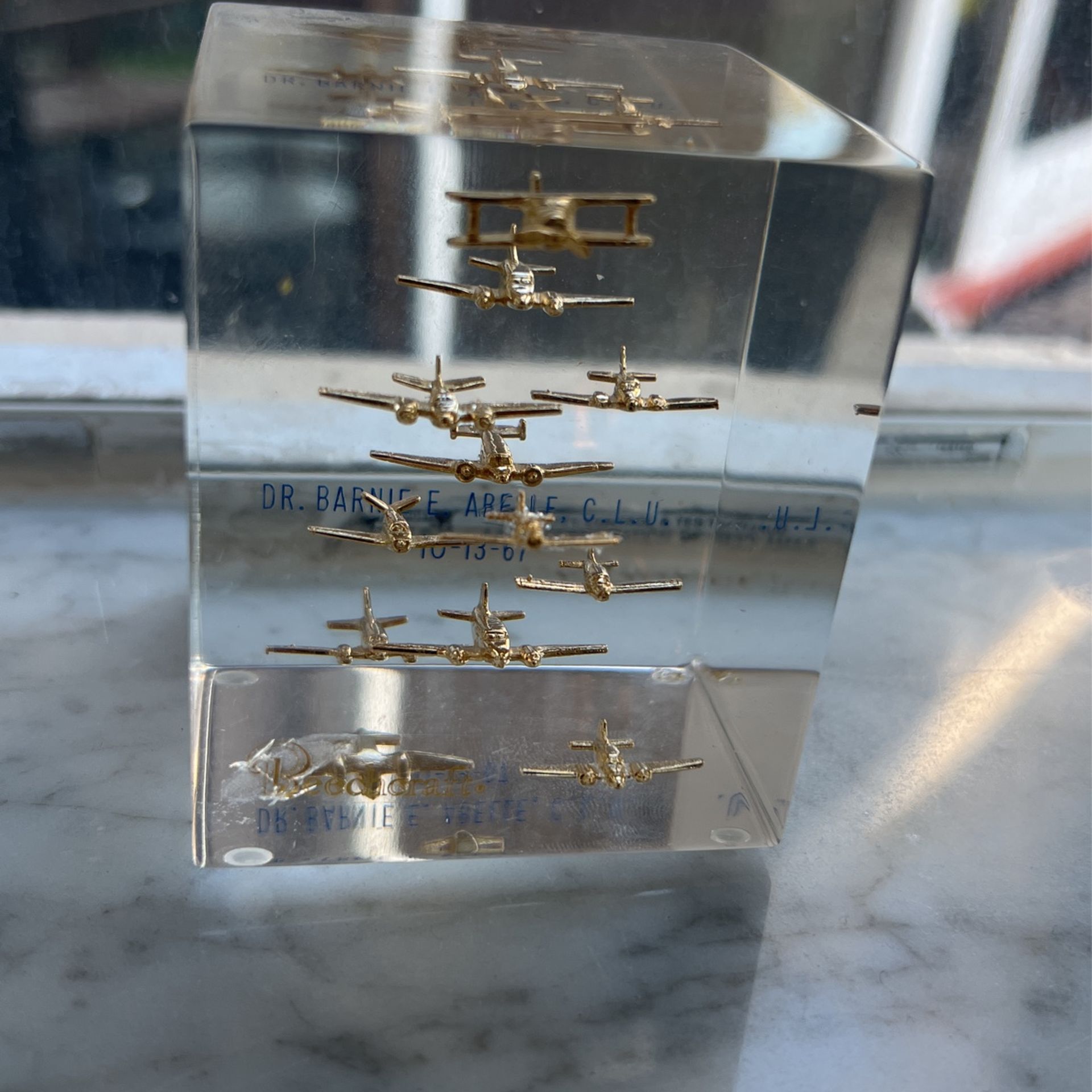 Clear Cube with Floating Gold Airplanes Paperweight