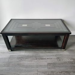 Glass top wheeled coffee table 